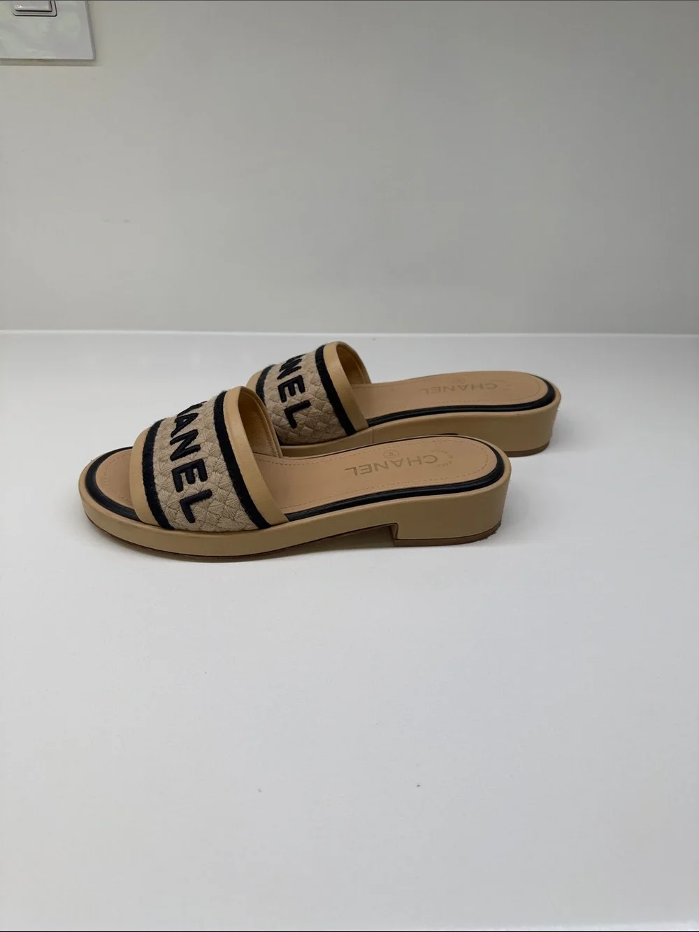 CHANEL Tan and Black Quilted Logo Slide Mules